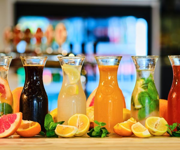 Assortment of cold lemonade on the barcounter (soft focus photo with shallow depth of field)